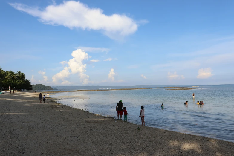 people playing in the water on a sunny day