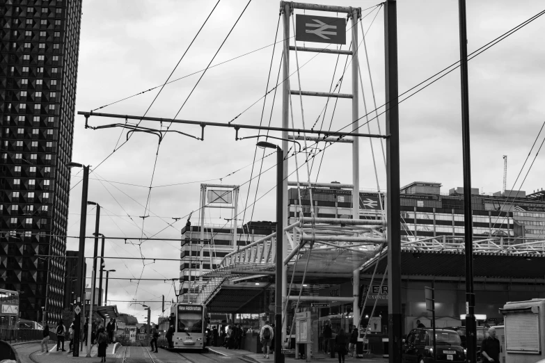 a black and white po of people at a train station