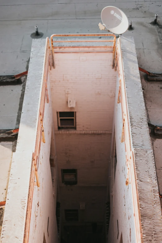 an open hallway leading to a wall with a door