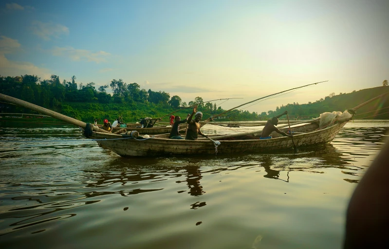 two people in a rowboat on the water