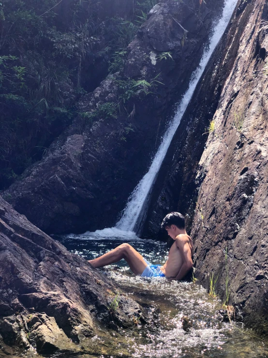 a man that is sitting in the water