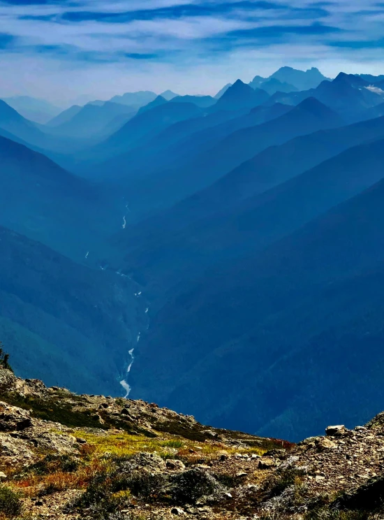 a person is standing on a mountain top