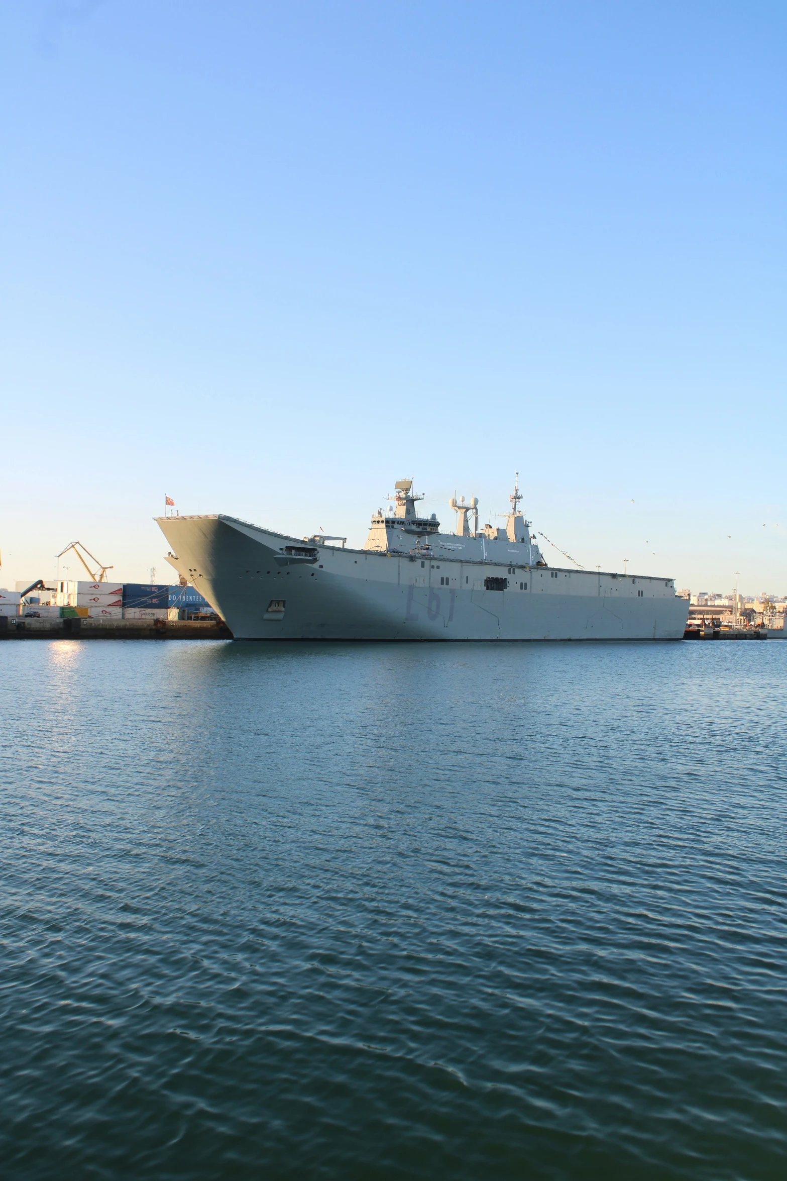 a large boat in the water next to buildings