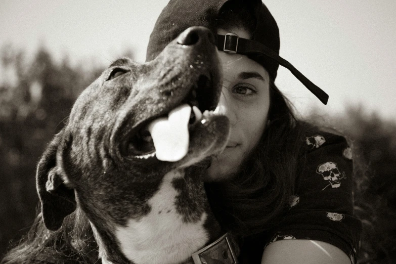 the dog is laying its head on a man's arm