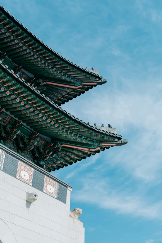 the roof on top of a building under blue skies