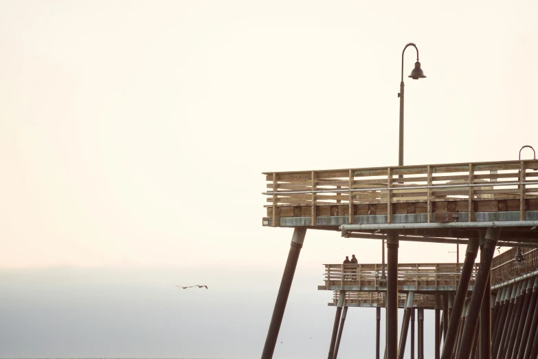 the ocean front of an old wooden pier