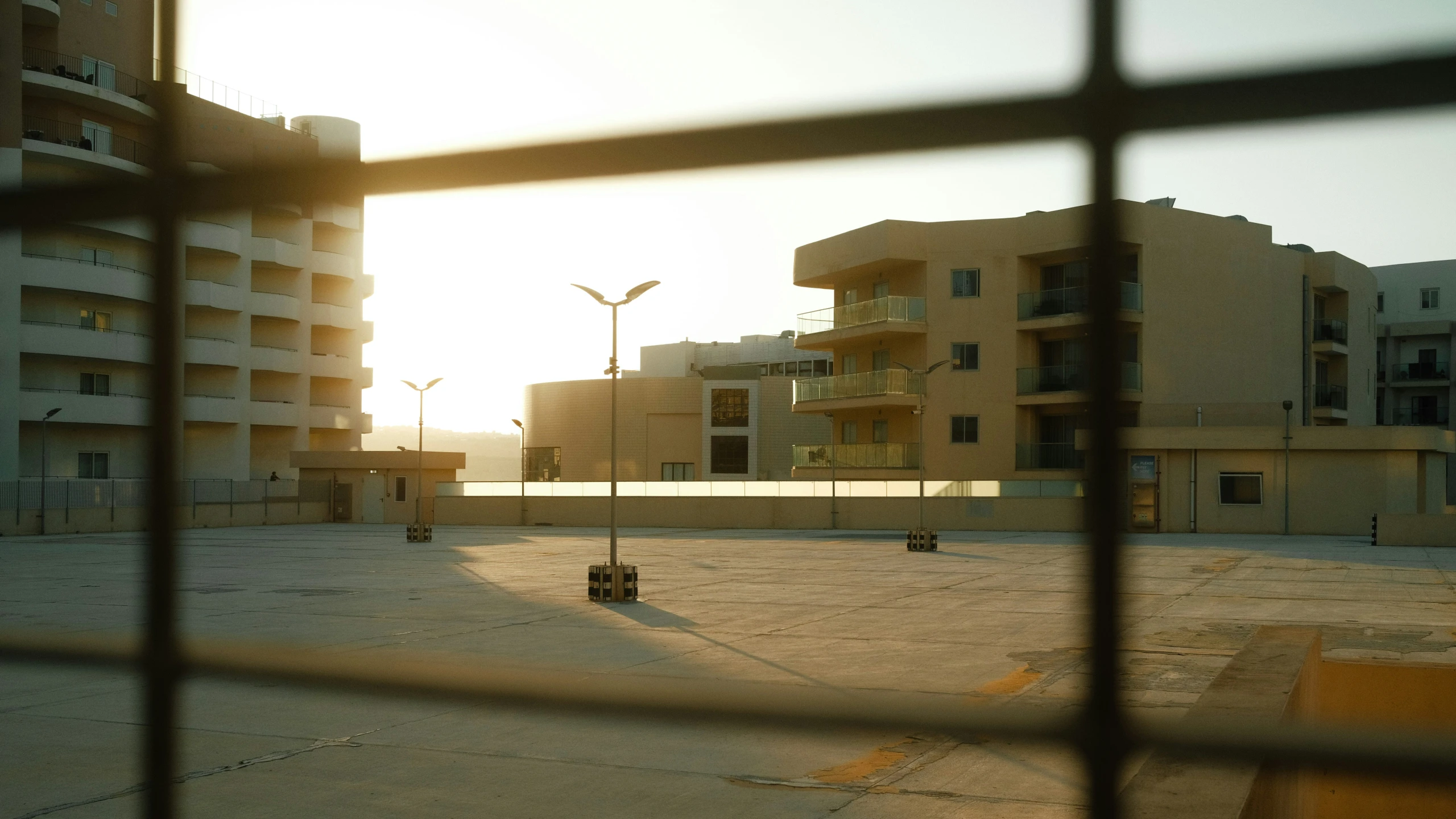 a couple of buildings near a fence