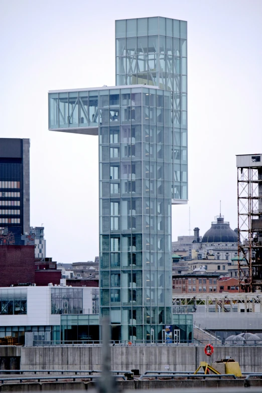 an unusual looking building stands in front of the city