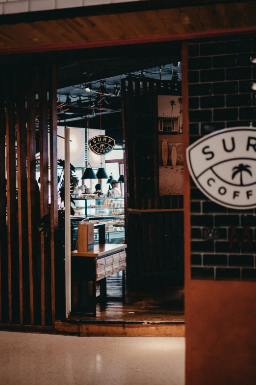 the entrance to surf shop coffee on a rainy day