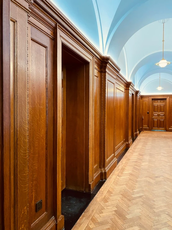 empty and light wood building with an arched ceiling