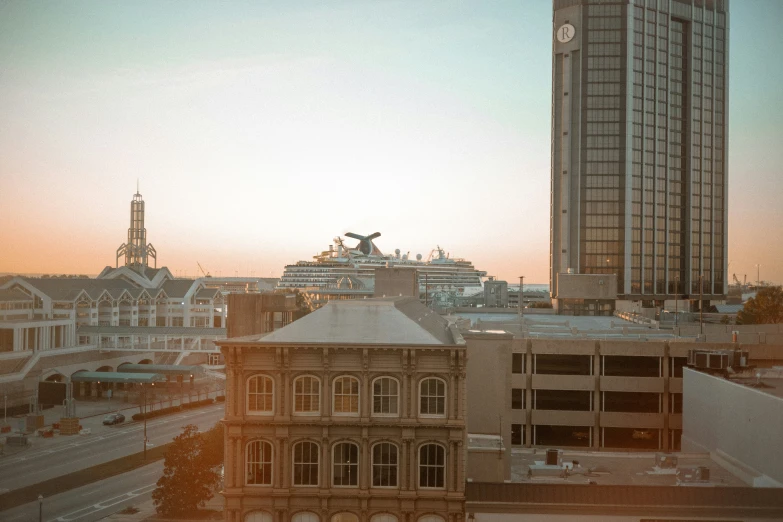 there is a clock tower towering over the buildings