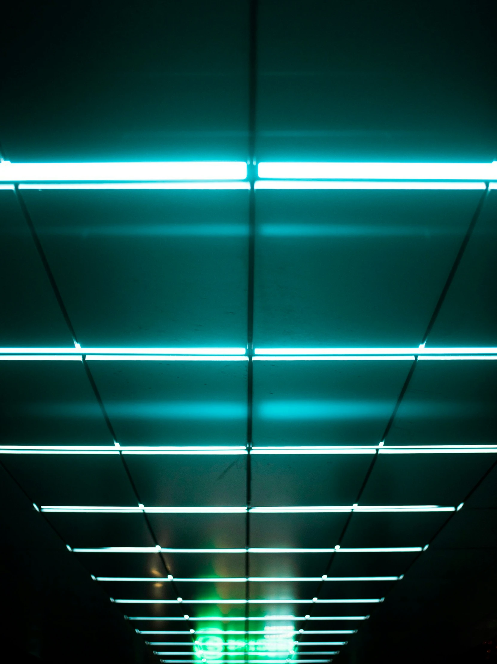 an overhead walkway is shown with fluorescent lights