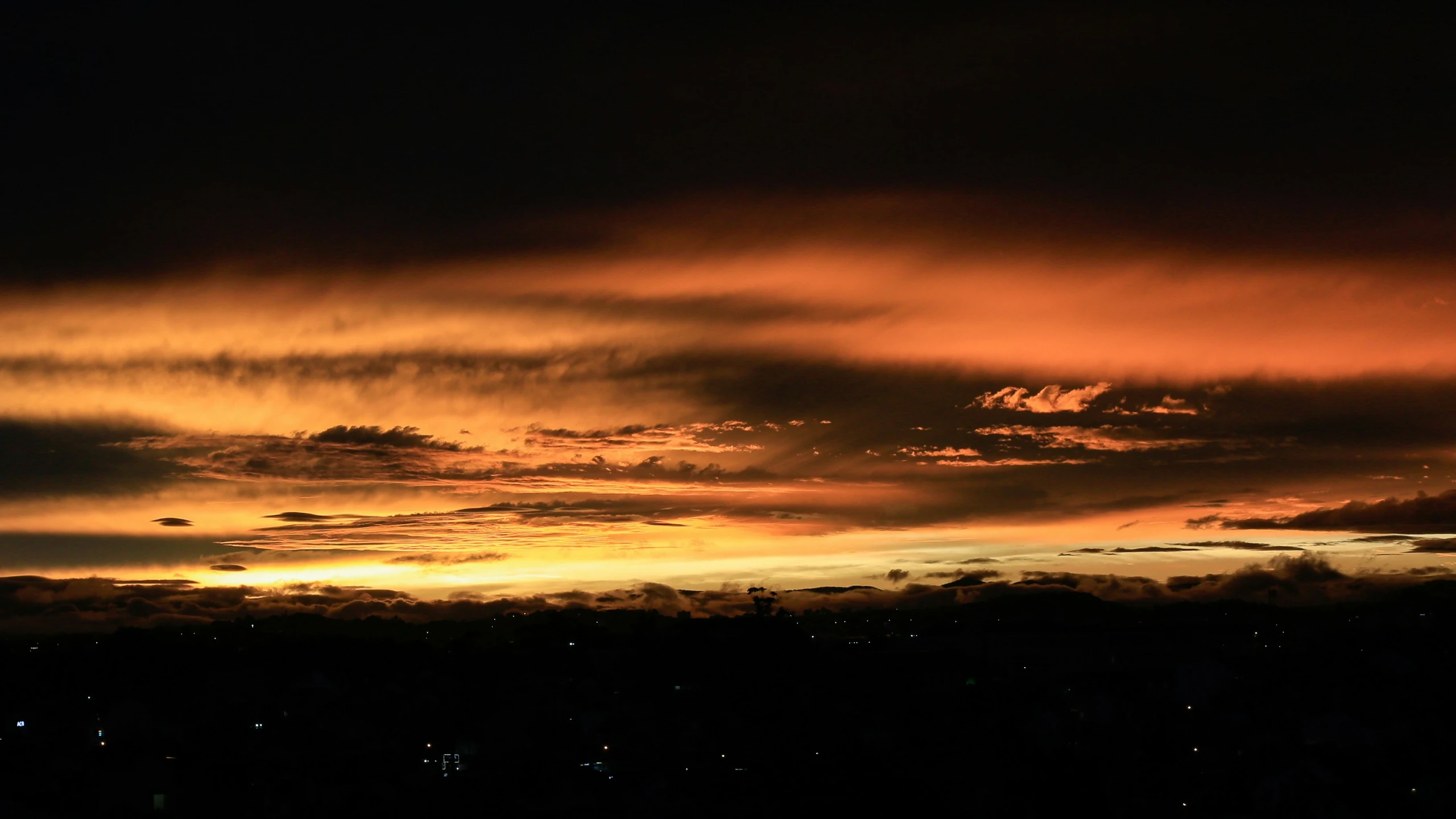 the orange sky is dark in the evening