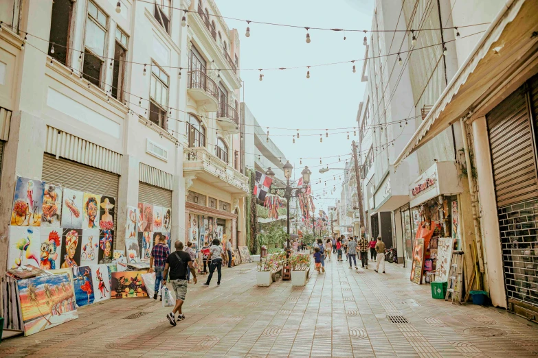 an empty street in the middle of a city, with buildings all around