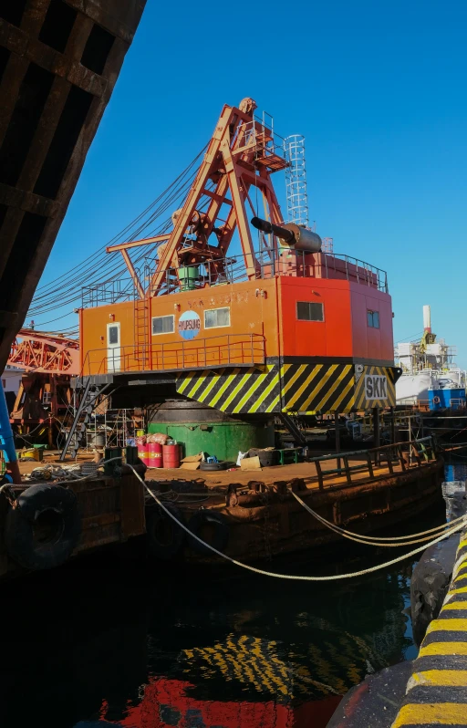 a crane is docked next to the water