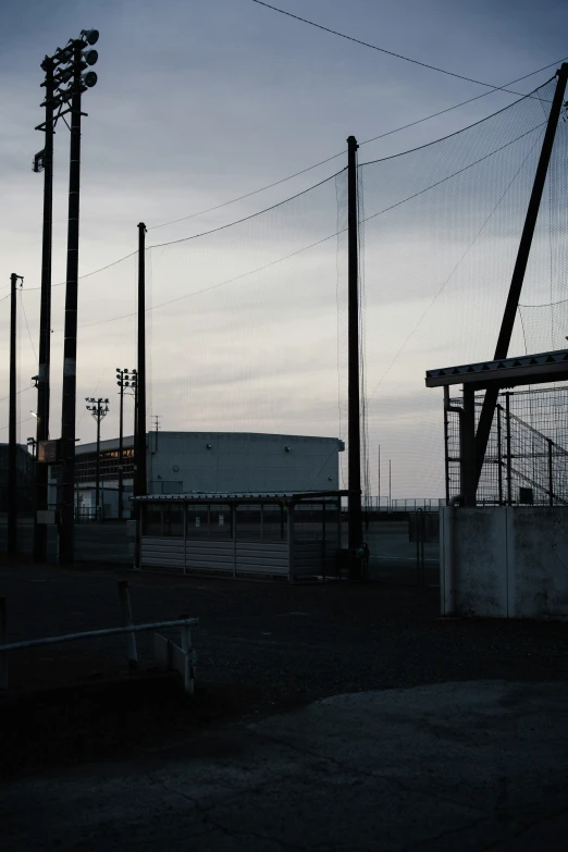 a building sits with barbed wire on the outside