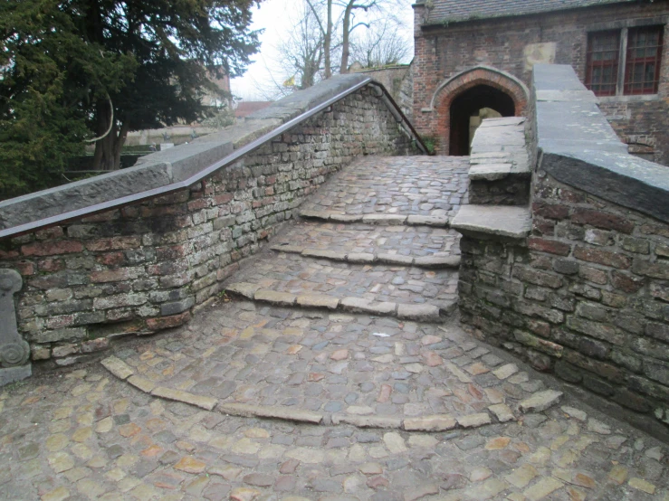 steps with cobblestone on the side of an old building