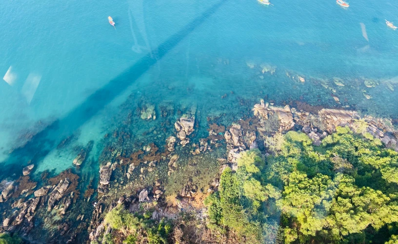 an aerial po of the beach near an ocean