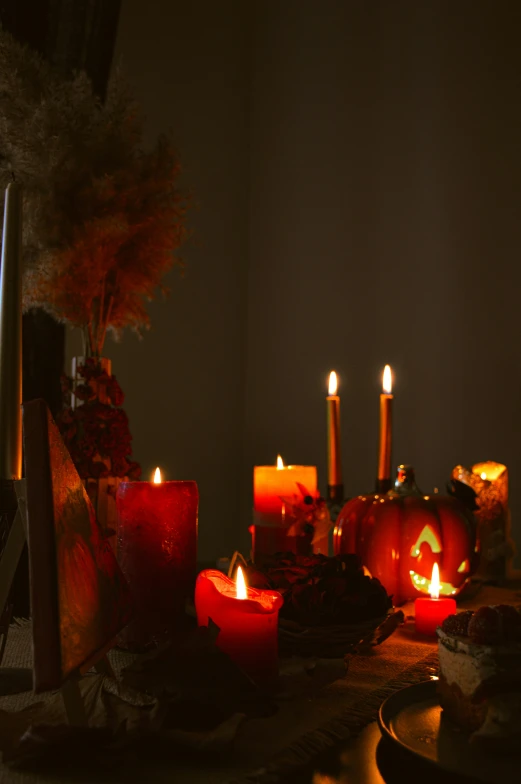 a lighted table with candles on it