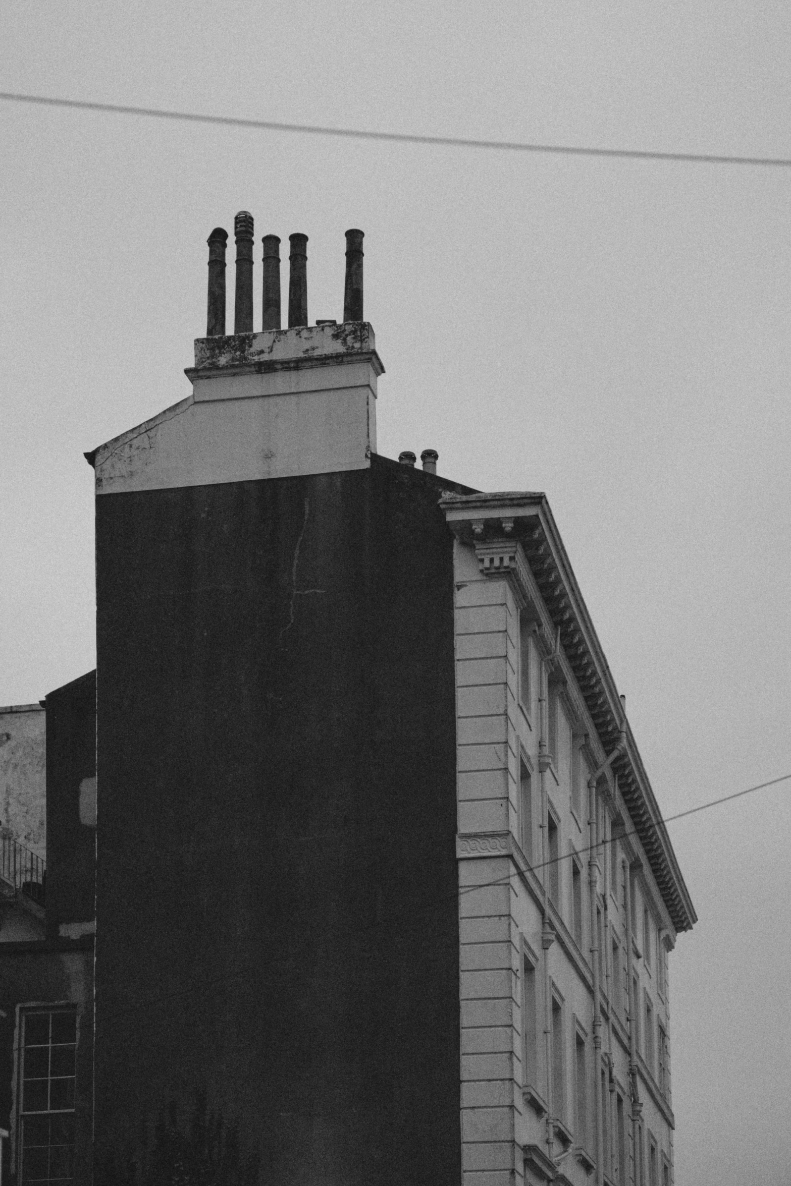 a large building with some big chimneys on it