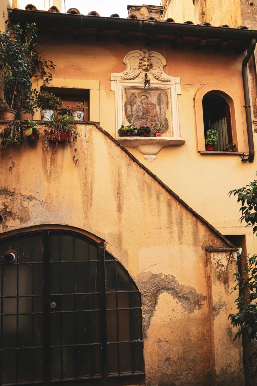 a door and window are open on the outside of an old building