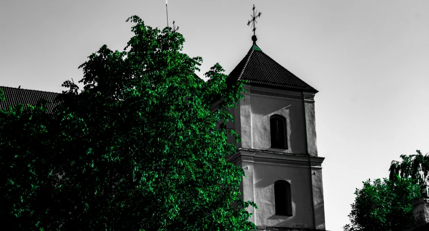 this is a black and white po of a church in the woods