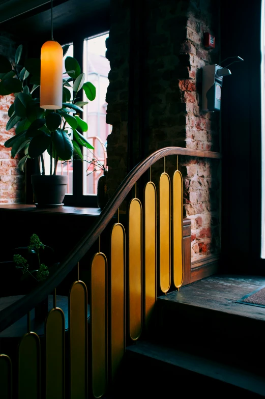 a window with candles is next to stairs