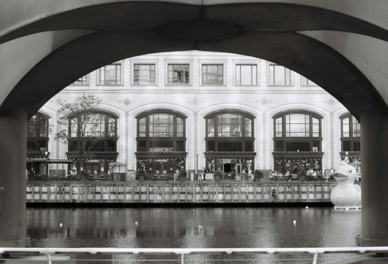 a large body of water sitting under a bridge