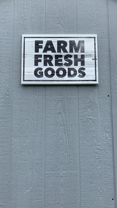 a sign is mounted to the side of a building