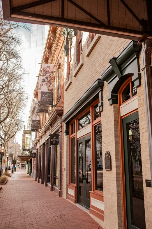 the side walk shows a cobbled brick street