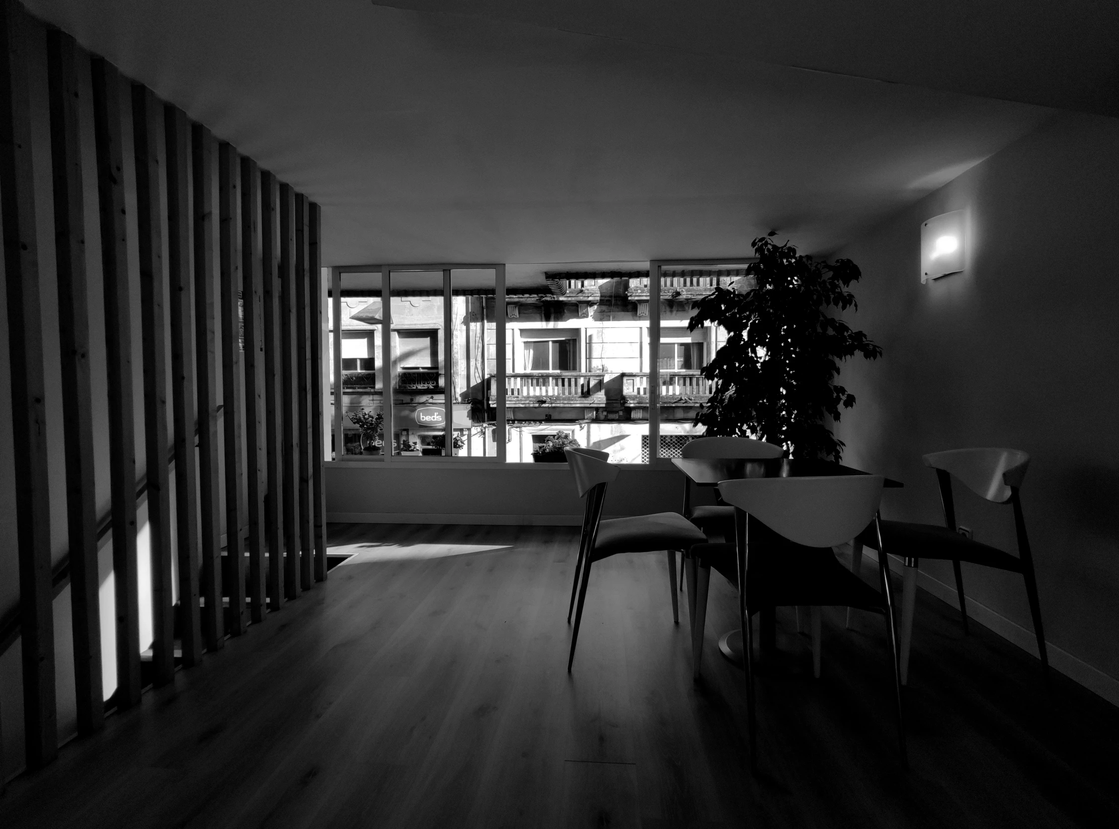 a black and white po of a living room in an apartment