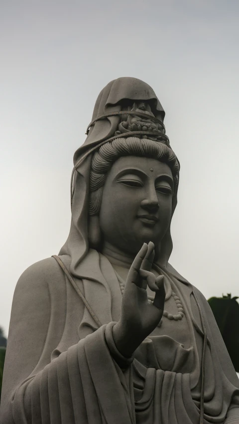 an odd statue of a buddha looks over its shoulder