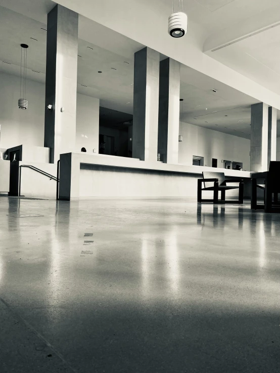 a empty room has several chairs and lights