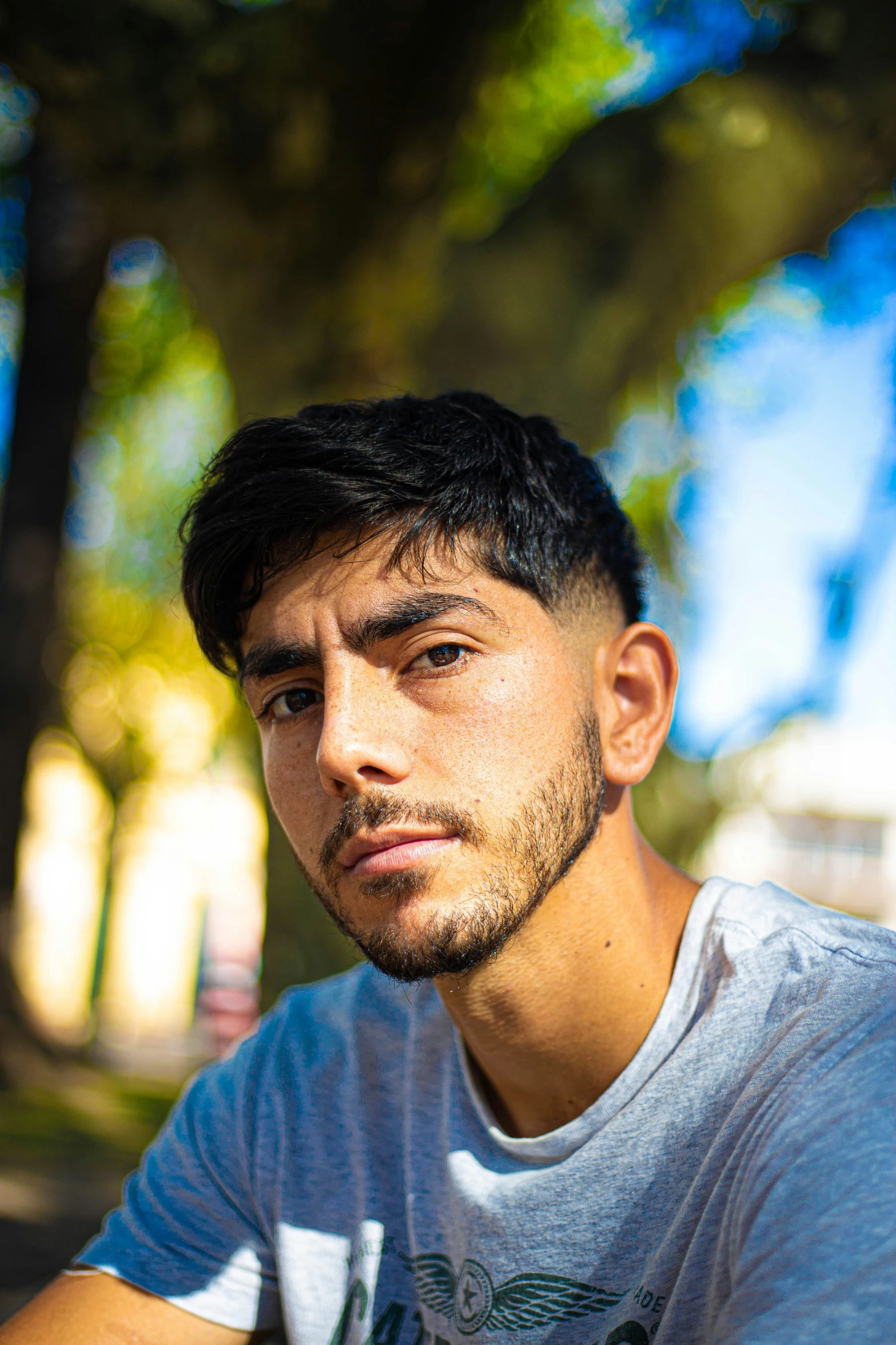 a man that is sitting down with his head to the side