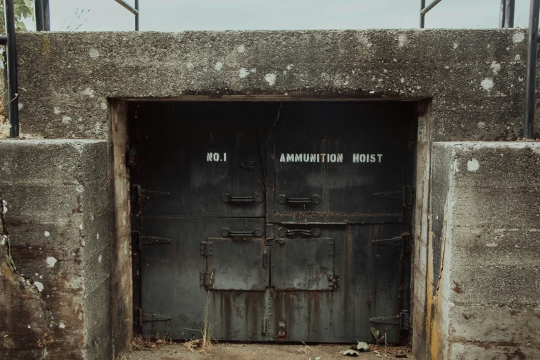 old, dirty doors are opened into an industrial building