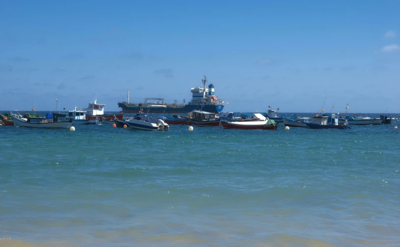 a lot of boats parked at the beach