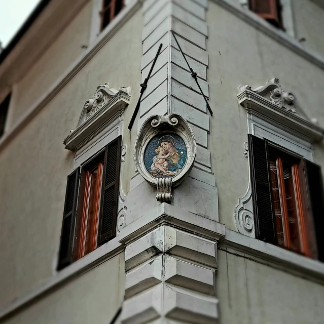 this is an image of a large building with two clocks on the side