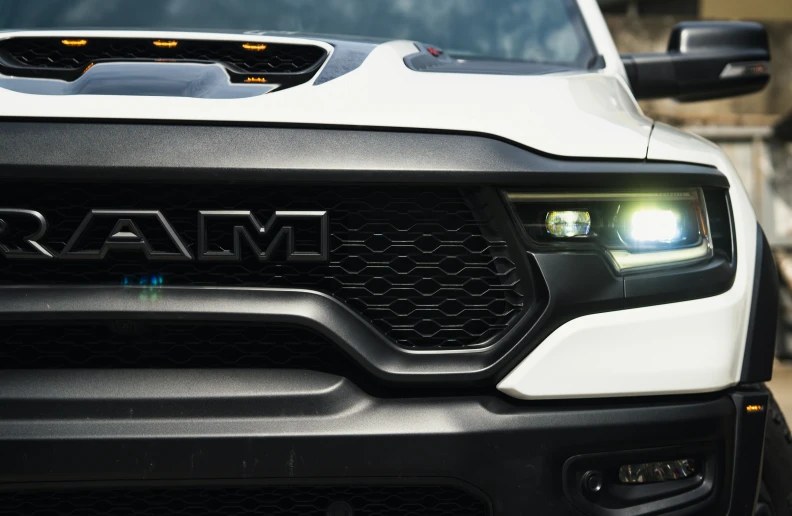 front grille and headlights of a white pickup truck