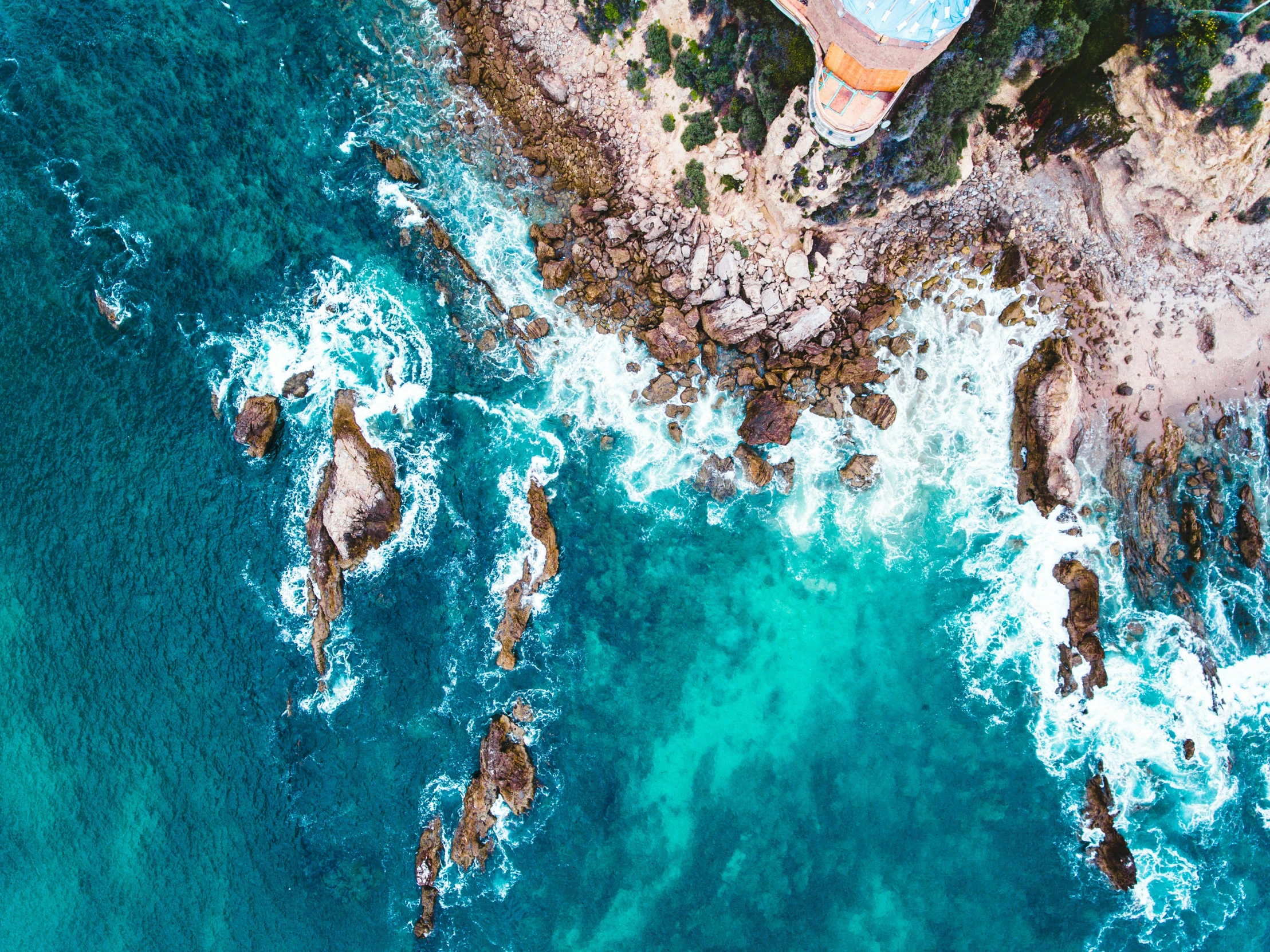 an aerial view of the sea shore