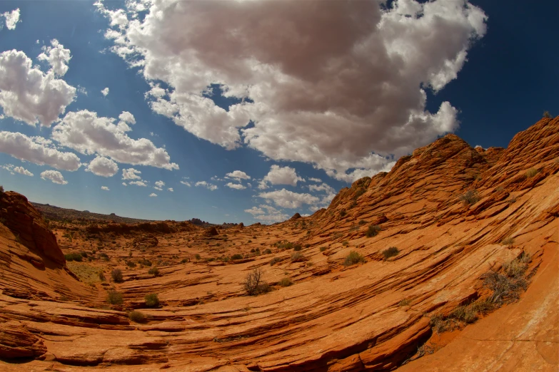 a wide panorama s of red earth terrain