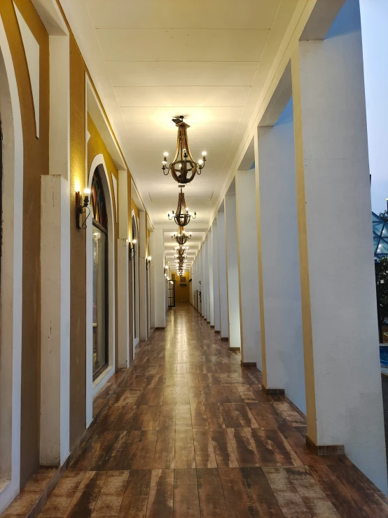 a long corridor leading from rooms down to the buildings