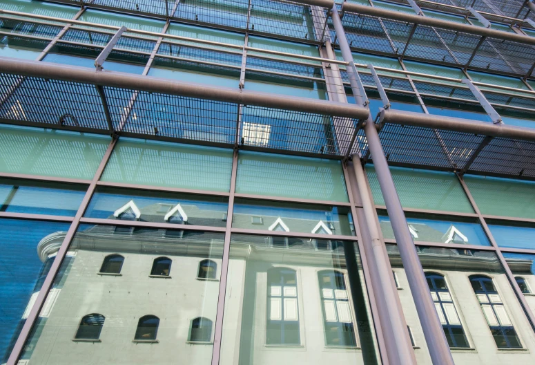 the view of the building's windows through an arch