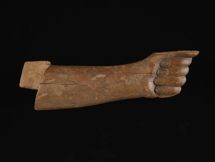 a wooden hand is shown in this po