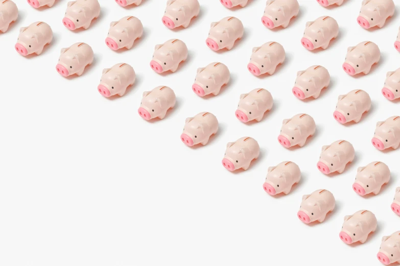 a group of pink pig heads in the middle of a row