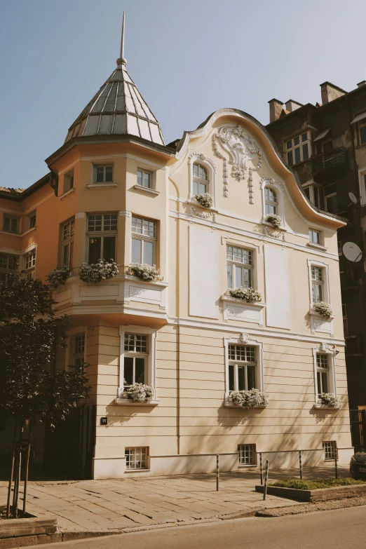 a large building with a steeple sits near many older buildings