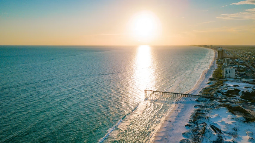 an ocean beach with a boat on the water