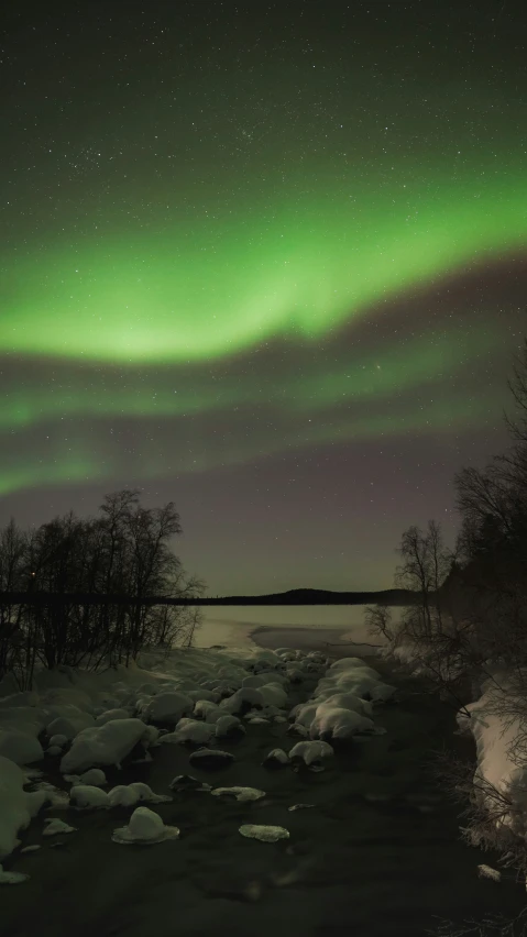 the aurora bore can be seen over a body of water