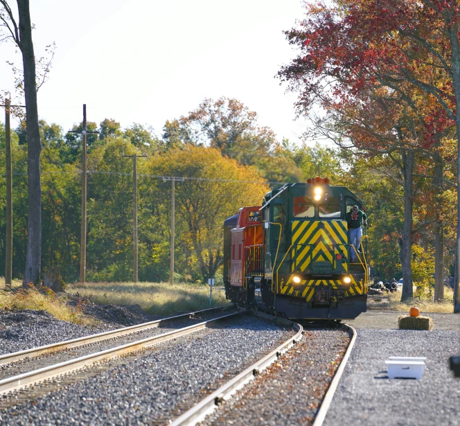 two trains pass each other on railroad tracks