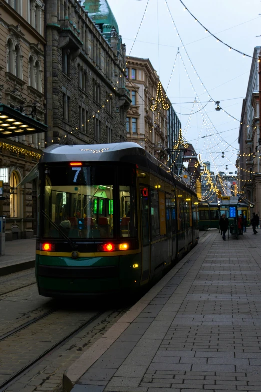 a trolley car is moving on the tracks