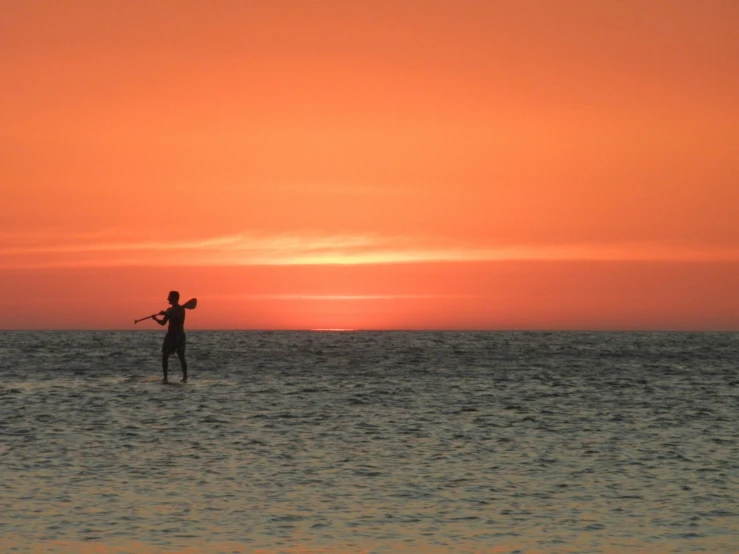 an image of a man that is standing on his surfboard